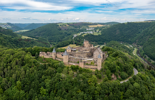 Honau - Reutlingen, Germany - September 30th, 2018: Done point of view Panorama over the Swabian Jura - Schwäbische Alb - with beautiful fairy-tale Castle Lichtenstein on top a steep rock on a sunny late summer day. Swabian Alb, Reutlingen, Baden Wurttemberg, Germany, Europe