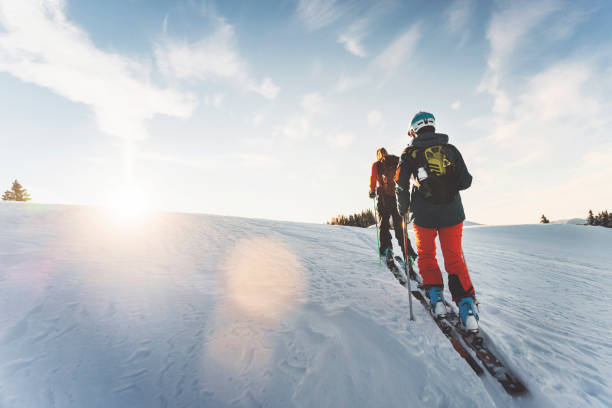 Portrait of skiing couple on mountain top, Whistler, B.C.