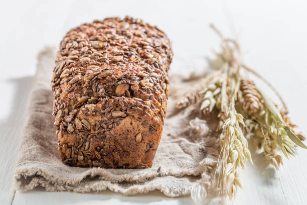 istock Bread with several grains and ears of wheat for breakfast 1401119780