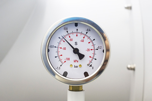 Vacuum pressure gauge, part of vacuum chamber in laboratory.