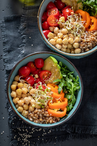 istock Healthy salad with groats, chickpeas, arugula and vegetables. 1401120389