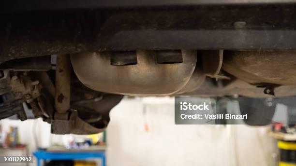 Car Exhaust System Car Underneath Stock Photo - Download Image Now - Adjusting, Air Pollution, Bumper