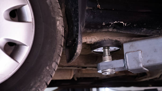 istock Old car lifting during repairing 1401122956