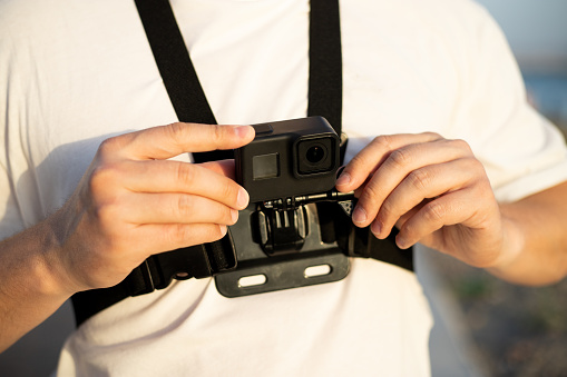 Man with chest strap mount belt for action camera