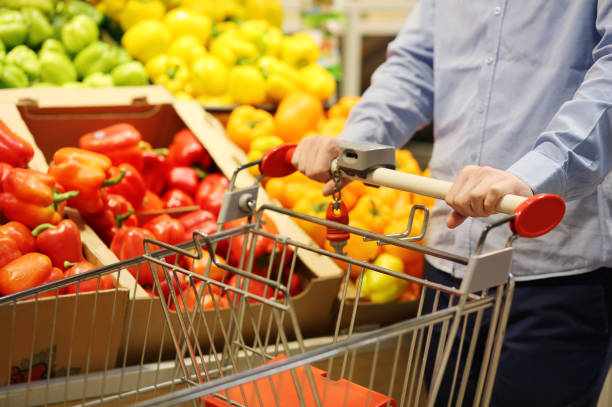 istock buying tomatoes at the market 1401128272