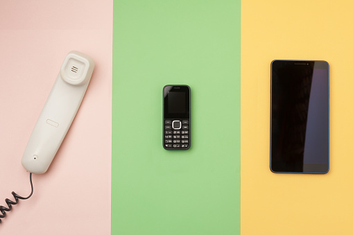 three devices symbolizing the history of communication technology