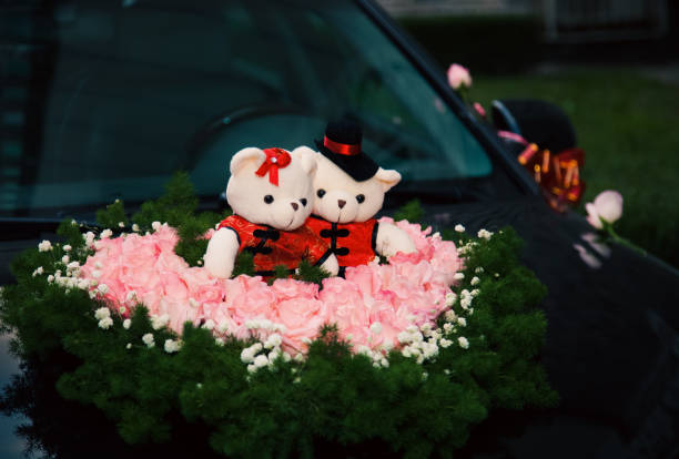 Black wedding car decorated with red ribbons. Chinese traditional wedding.