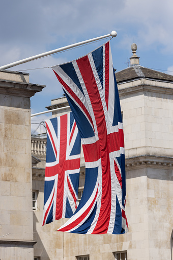 Union Jack flag and London street in a background during the Platinum Jubilee celebration