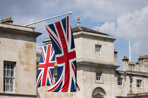 Union Jack flag and London street in a background during the Platinum Jubilee celebration