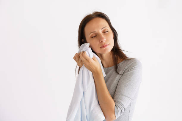 istock Woman holding clean white scented shirt 1401135088
