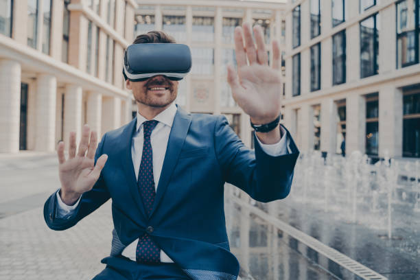 istock Excited office worker in formal suit checking information in virtual reality 1401136432