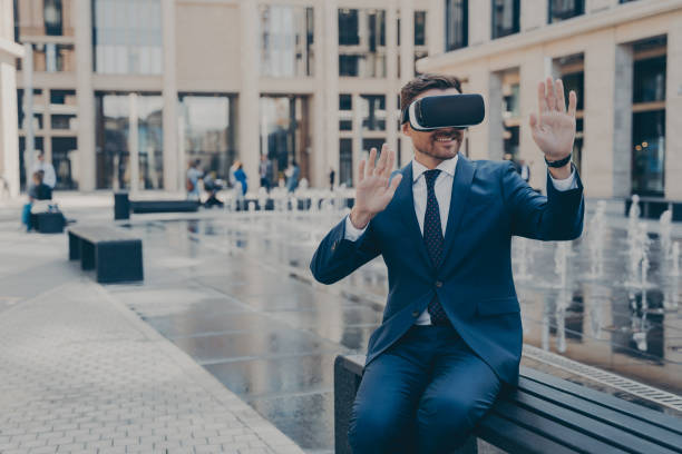 istock Young business owner in blue formal suit reviewing projects in virtual reality 1401136437