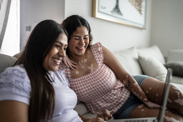 istock Friends using the laptop at home 1401137363