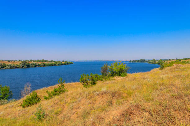 istock Summer landscape with beautiful river, green trees and blue sky 1401137433