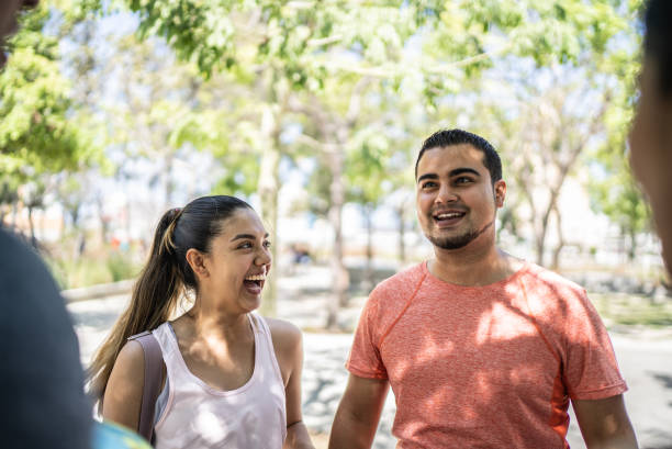 istock Friends talking laughing at the park 1401139086