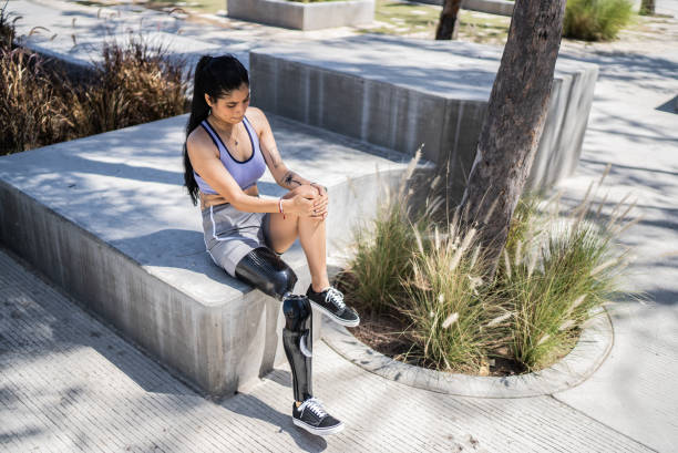 istock Disabled athlete woman stretching at the park 1401139111