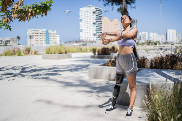 istock Disabled athlete woman stretching at the park 1401139135