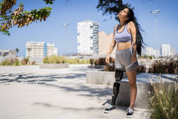 istock Disabled athlete woman stretching at the park 1401139137
