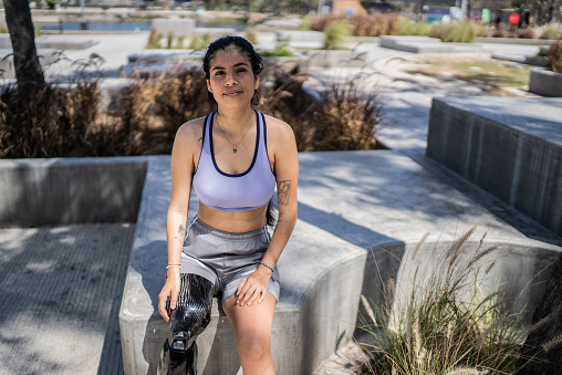 Portrait of a disabled athlete woman at the park