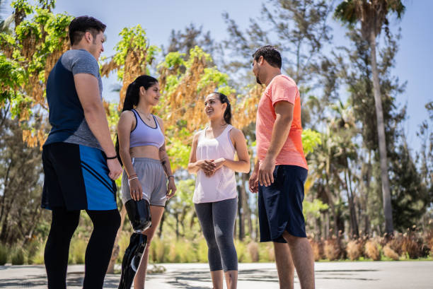 istock Young sporty friends talking at a park 1401139363