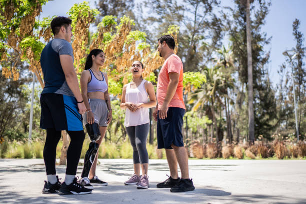 istock Young sporty friends talking at a park 1401139371