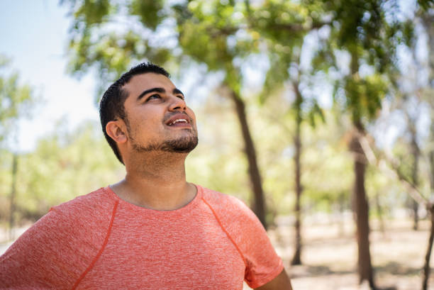 Young man contemplating at the park