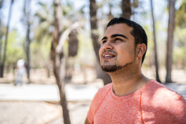 Young man contemplating at the park