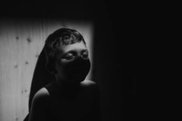 istock Black and white portrait of sad anonymous little boy 1401141396