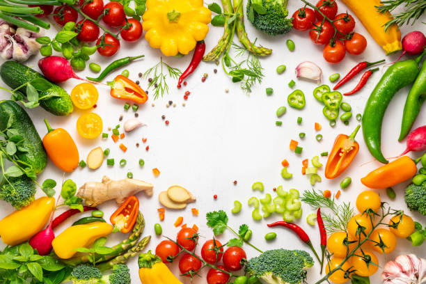 istock Fresh assorted vegetables and herbs on white background. Healthy clean eating, vegetarian or diet food concept.Food frame. 1401141398