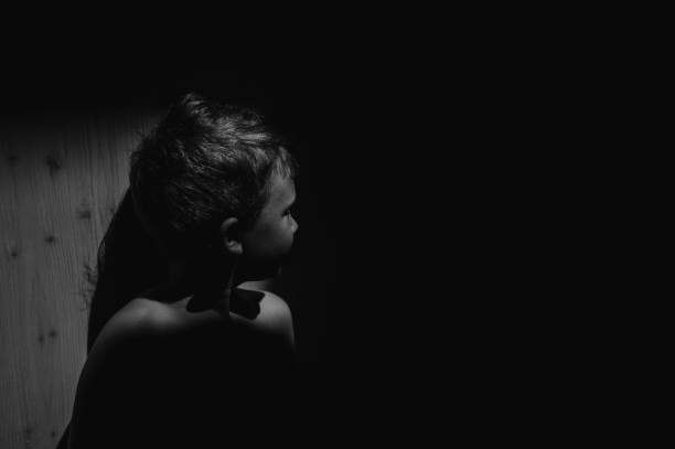 istock Black and white portrait of sad anonymous little boy 1401141408