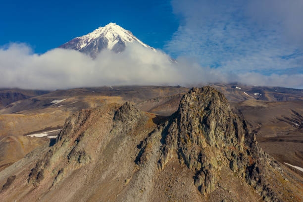 Verblyud (Camel) extrusion rock and the Koryaksky volcano on Kamchatka peninsula, Russia
