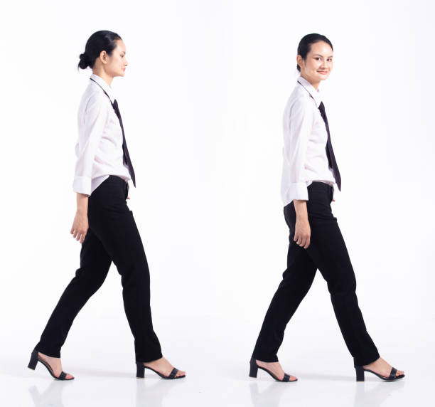 istock Full length 20s young Mix Race Woman  bartender worker employee, walking forward left right 1401144669