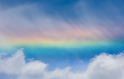 A rare straight rainbow appearing in the sky.