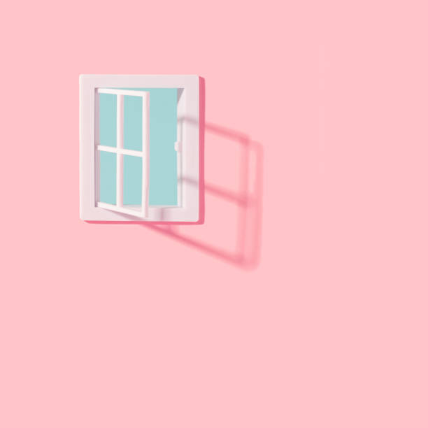 istock Open plastic window on a pastel pink wall with clear blue sky seeing through. 1401145917