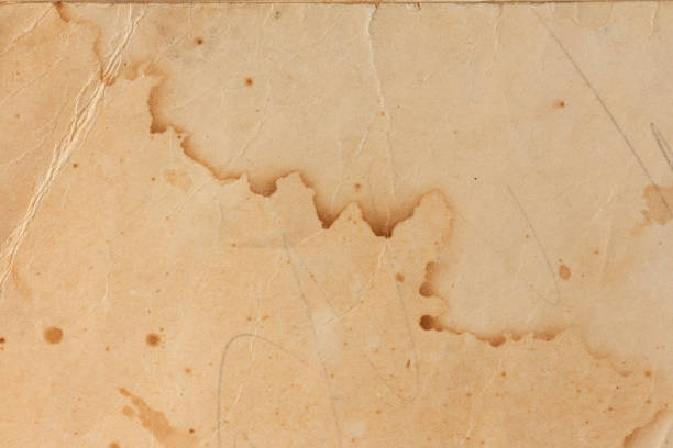 Old yellowed paper with stains from water
