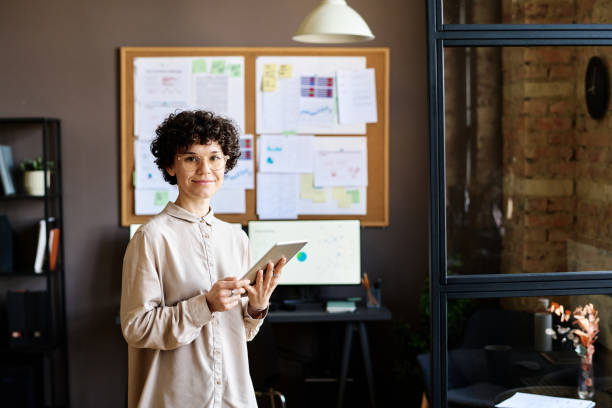 istock Woman working on tablet pc at office 1401147094