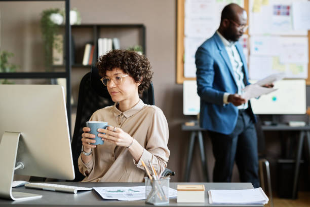 istock Businesswoman sitting at her workplace at office 1401147193