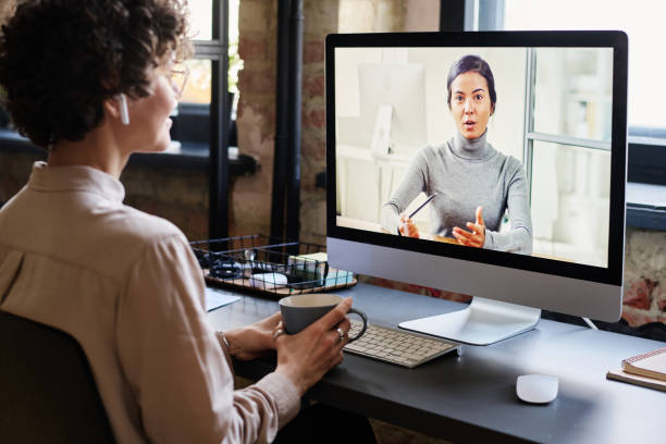 istock Online conversation with colleague at office 1401147282
