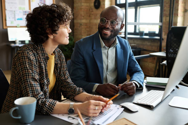 istock Business partners working over project together 1401150777