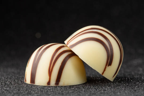 Chocolate bonbons closeup on a black background