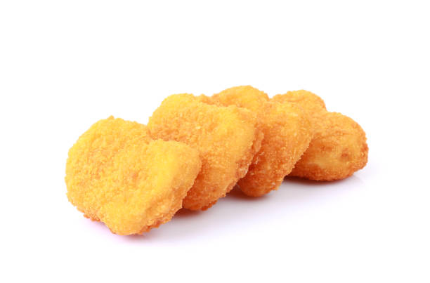 istock Chicken nuggets closeup isolated 1401155168