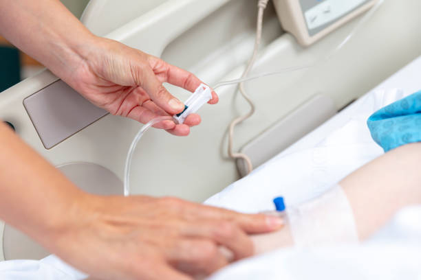 istock Female doctor opens vascular access to patient 1401162806