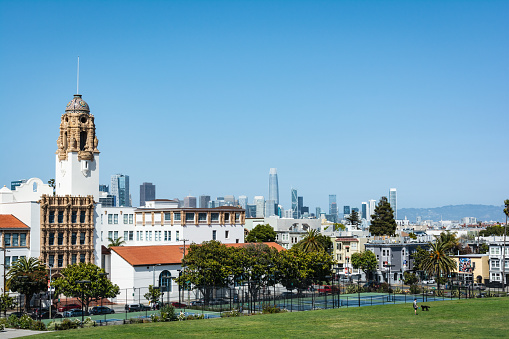 View of Mission Dolores Basilica and San Francisco skyline from Dolores Park, California