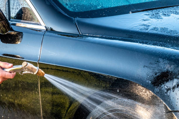 istock auto detailer washing luxury high end car 1401164307