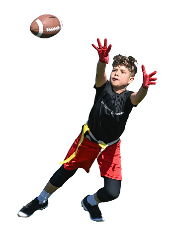 Young boy (child) in a uniform playing in a youth flag football game