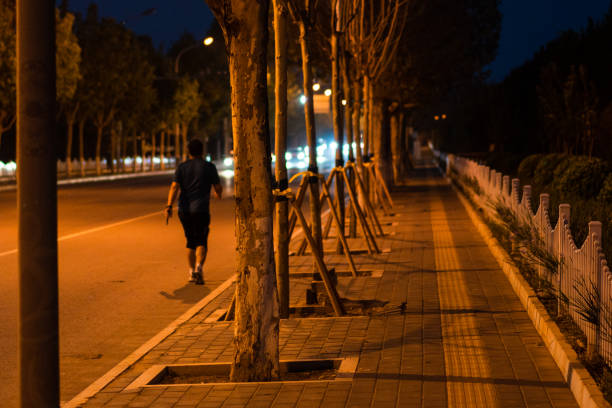 istock Pedestrians on the street at night 1401165382