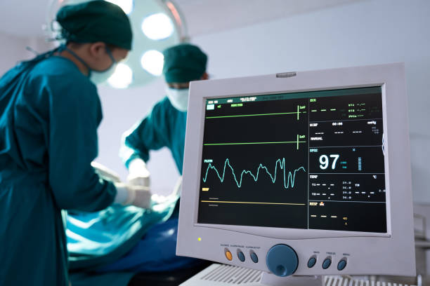 selective at monitor and nurse using defibrillator to pump at chest of unconscious with low heart rate patient to save life while doing medical surgery inside of operating room. emergency cpr. - surgeon urgency expertise emergency services imagens e fotografias de stock