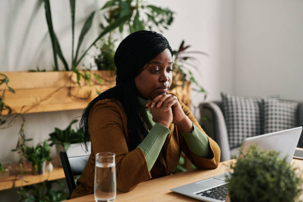 istock Young female psychoanalyst looking at patient during online session in office 1401170097