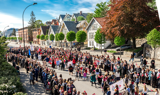 Annual Constitution Day parade in Stavanger city centre streets watched by locals and tourists, Norway, 17 May 2018