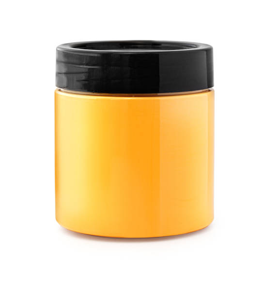 Glass jar with honey, or apricot jam isolated on a white background with a cut-out path